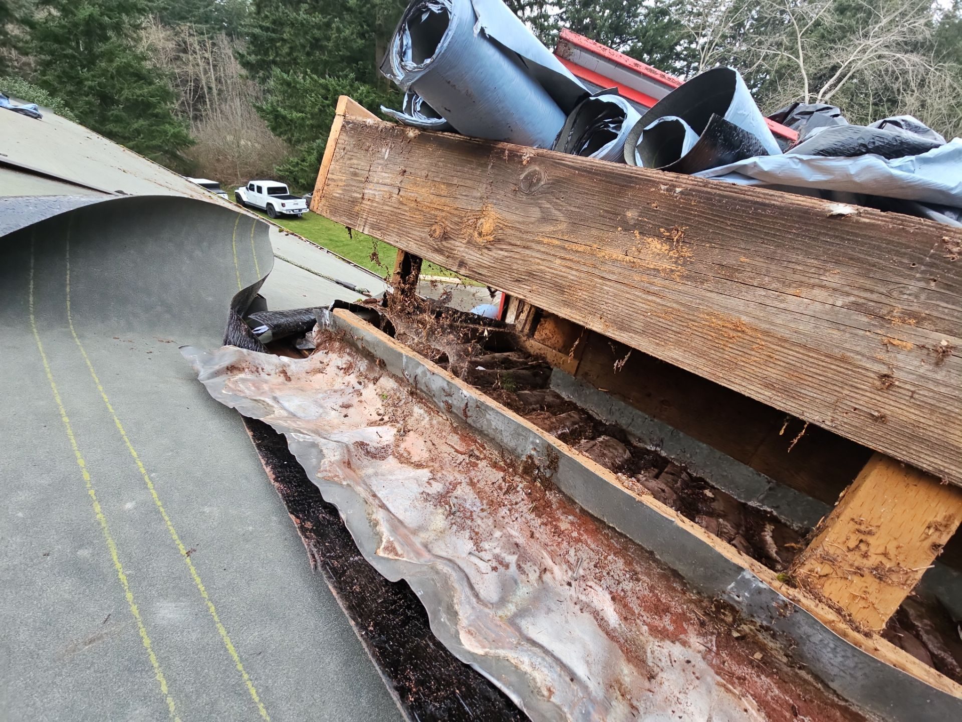 Tear-off and substrate exposure during Antique Clay Brava Spanish barrel tile install in Camano Island, WA